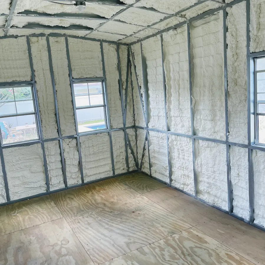 Closed-cell spray foam insulation applied to wall cavities in a residential project in Milford